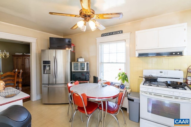 kitchen featuring stainless steel fridge with ice dispenser, extractor fan, decorative backsplash, white cabinets, and white gas range oven