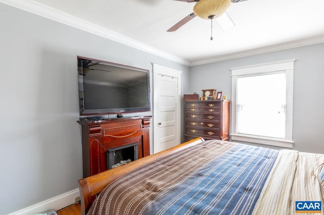 bedroom featuring ceiling fan and ornamental molding