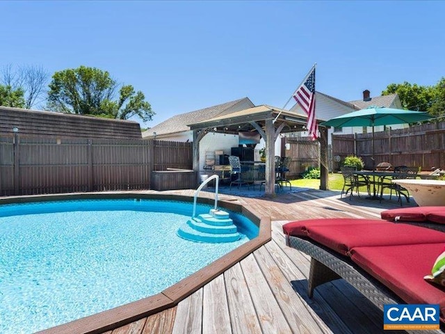 view of swimming pool featuring a deck