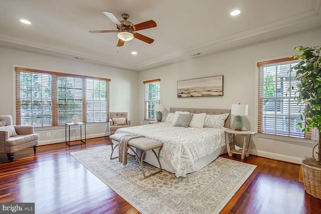 bedroom with dark hardwood / wood-style flooring and ceiling fan