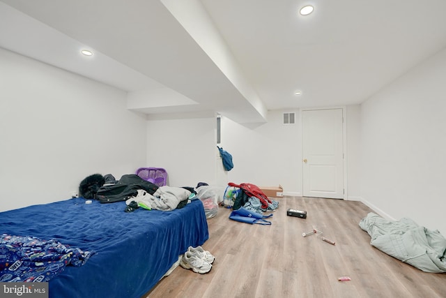 bedroom with wood-type flooring