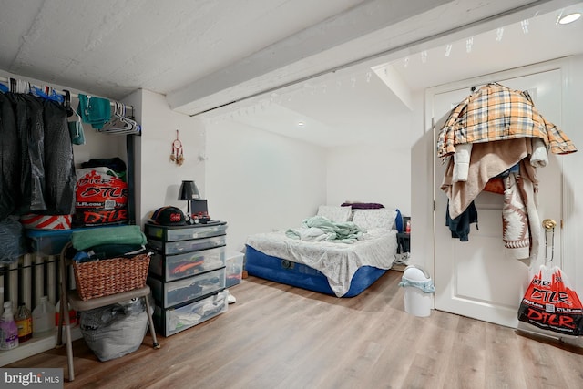 bedroom with wood-type flooring