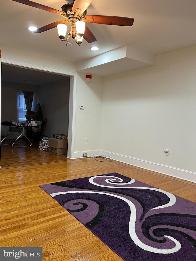 interior space featuring hardwood / wood-style flooring and ceiling fan