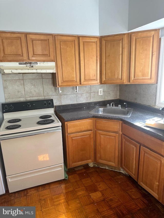 kitchen with dark parquet floors, sink, white electric stove, and tasteful backsplash