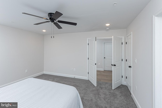 carpeted bedroom featuring ceiling fan