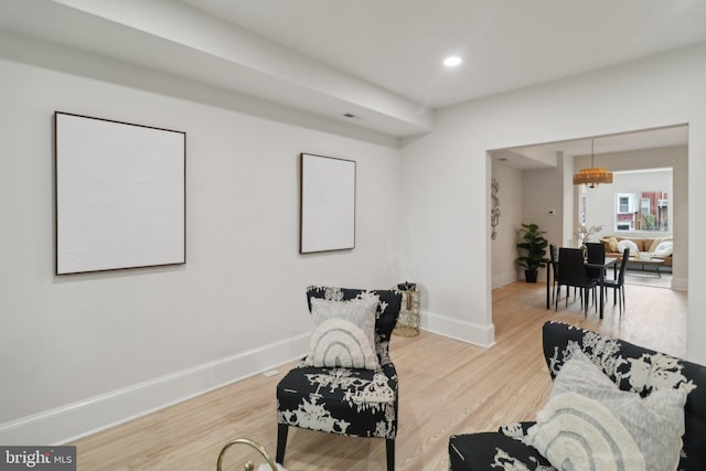 sitting room featuring hardwood / wood-style floors