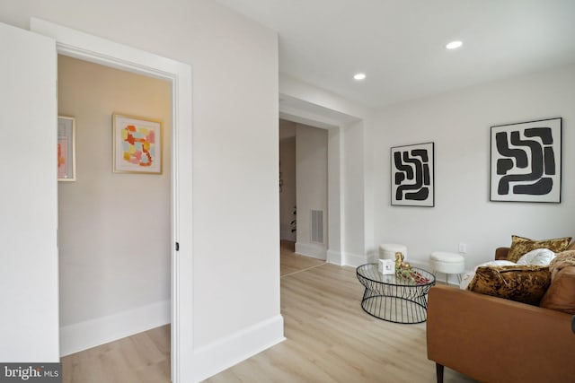 sitting room featuring light hardwood / wood-style flooring