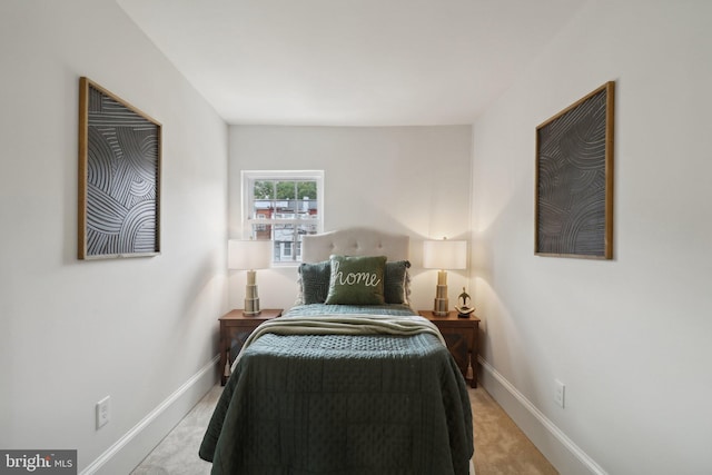 bedroom featuring light colored carpet