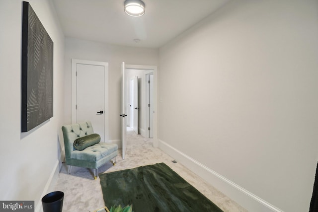 hallway with light colored carpet