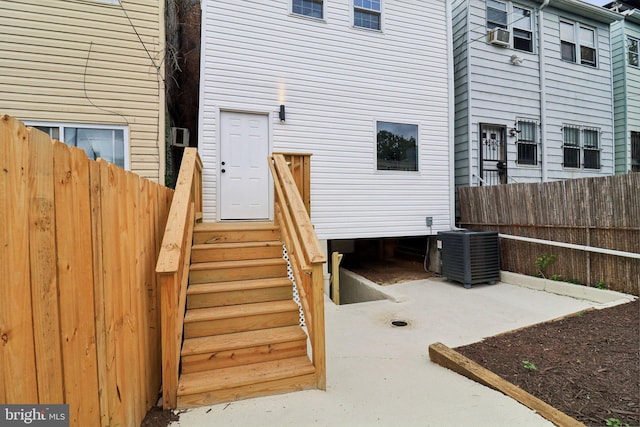 entrance to property with cooling unit and central air condition unit