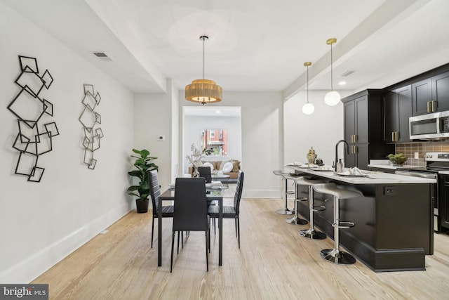 dining area featuring light hardwood / wood-style flooring