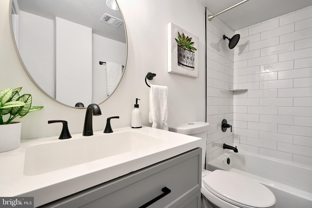 full bathroom with vanity, toilet, and tiled shower / bath