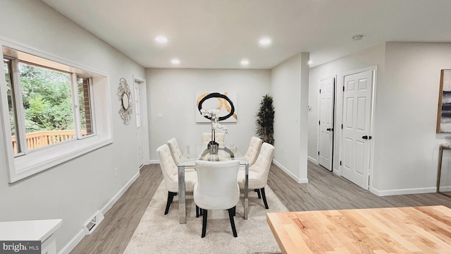 dining room featuring light hardwood / wood-style floors