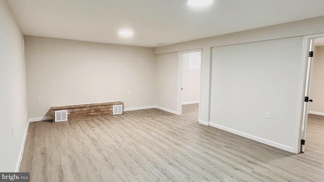 unfurnished room with light hardwood / wood-style floors