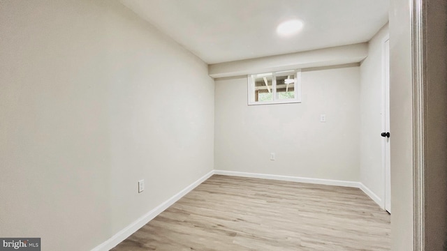 unfurnished room with light hardwood / wood-style flooring