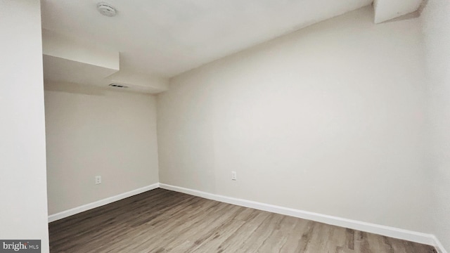 spare room featuring hardwood / wood-style flooring