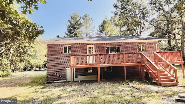 back of property with a wooden deck