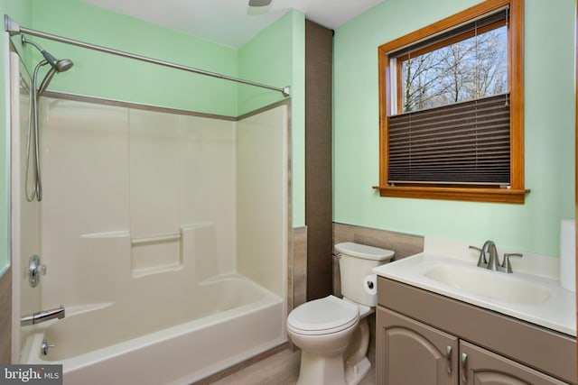 full bathroom featuring shower / bathing tub combination, vanity, and toilet