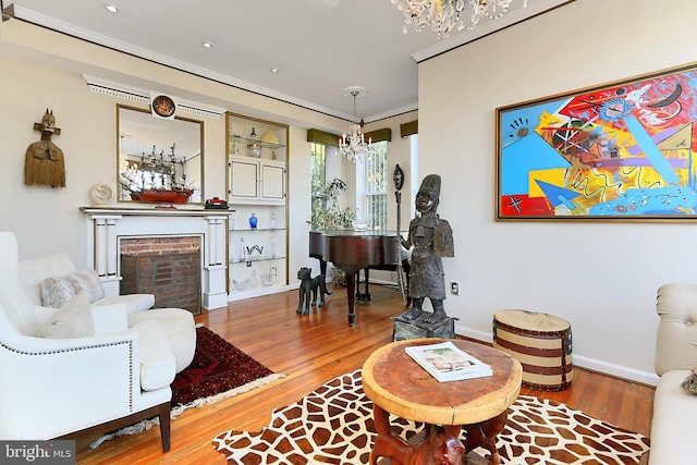 living room with hardwood / wood-style floors and crown molding