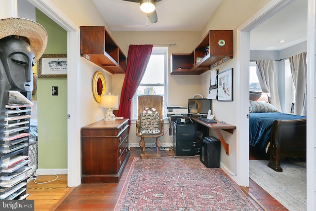 office featuring ceiling fan and dark wood-type flooring