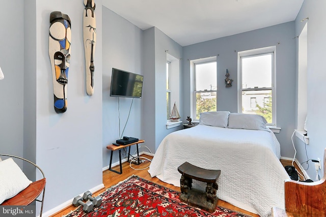 bedroom featuring light wood-type flooring