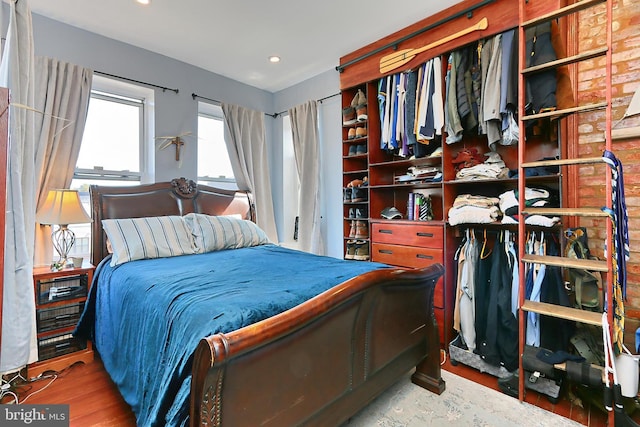 bedroom with wood-type flooring