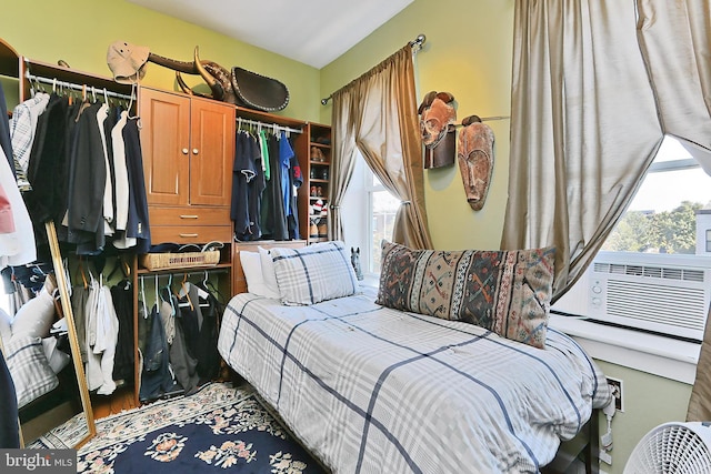 bedroom featuring a closet and cooling unit