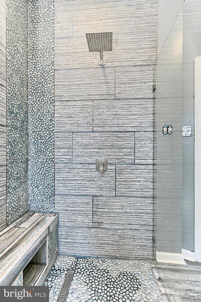 bathroom with tiled shower