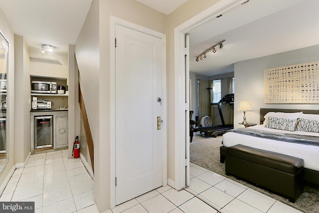 tiled bedroom featuring wine cooler