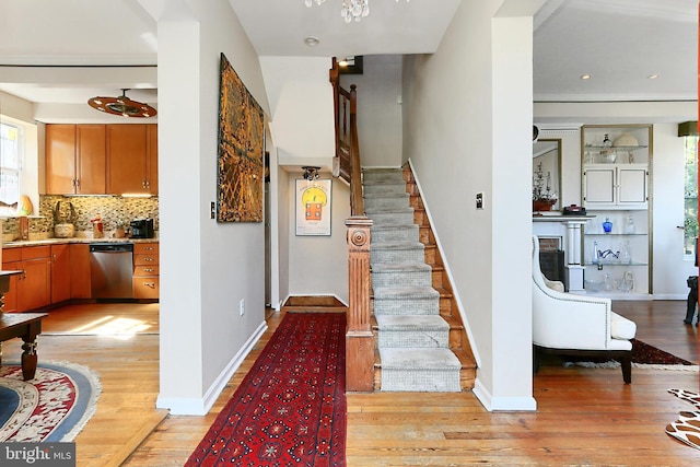 staircase with hardwood / wood-style floors