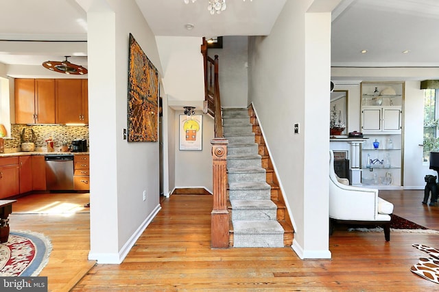 stairs featuring wood-type flooring