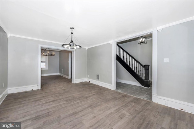unfurnished living room featuring dark hardwood / wood-style flooring and crown molding