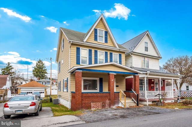 view of front of property featuring a porch and central AC