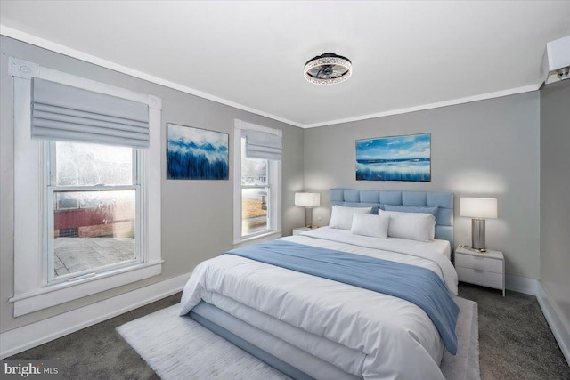 bedroom with dark colored carpet and crown molding