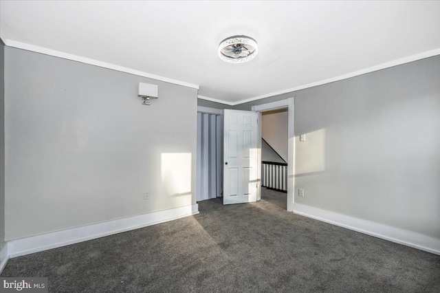 carpeted empty room with crown molding