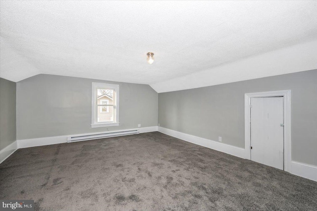 bonus room with dark carpet, lofted ceiling, a textured ceiling, and a baseboard radiator