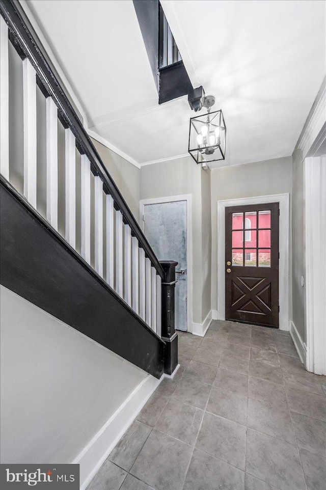 entrance foyer featuring a chandelier