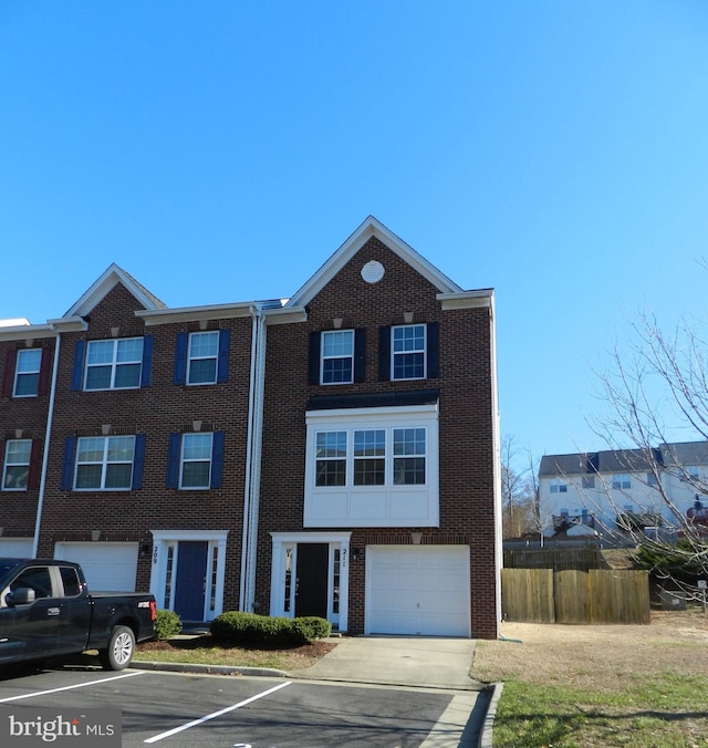 townhome / multi-family property featuring a garage