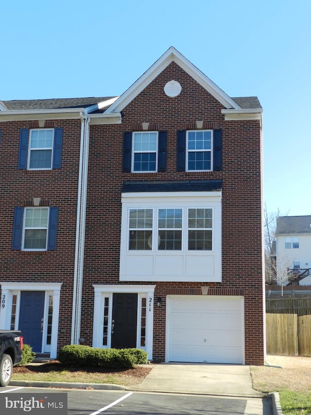 multi unit property featuring a garage