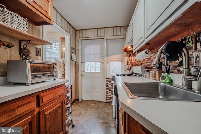 kitchen with wooden walls and sink