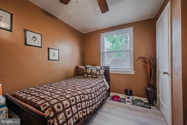 bedroom with ceiling fan and light hardwood / wood-style flooring