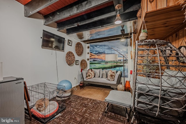 misc room featuring beam ceiling, dark parquet flooring, and wooden ceiling