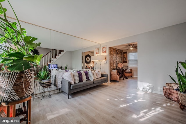 living room with ceiling fan and wood-type flooring