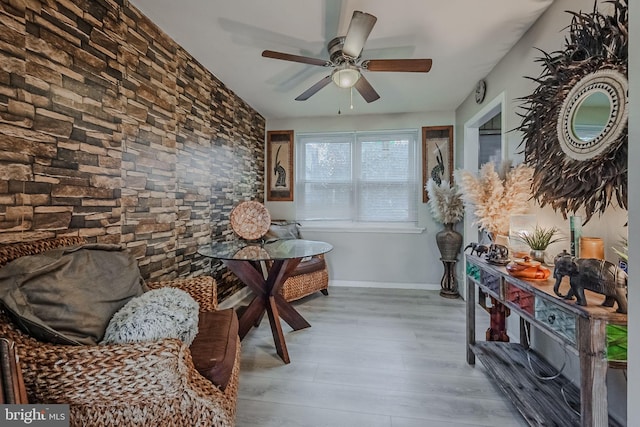 interior space with light hardwood / wood-style floors and ceiling fan