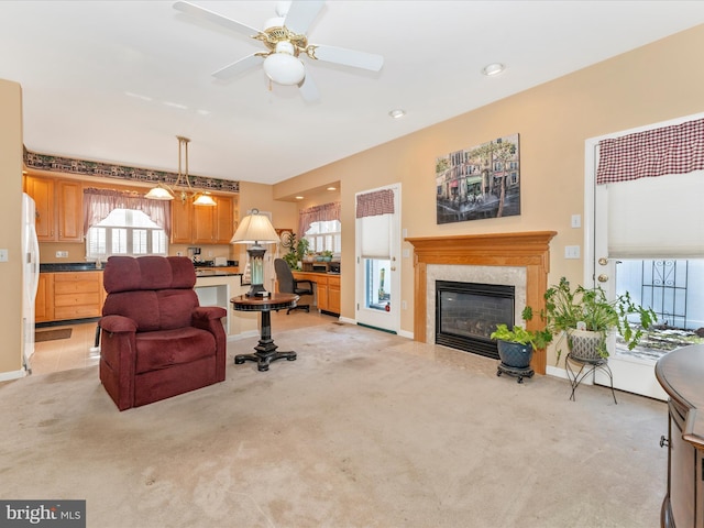 living room featuring light carpet and ceiling fan