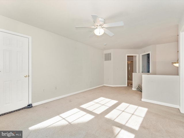 carpeted empty room with ceiling fan