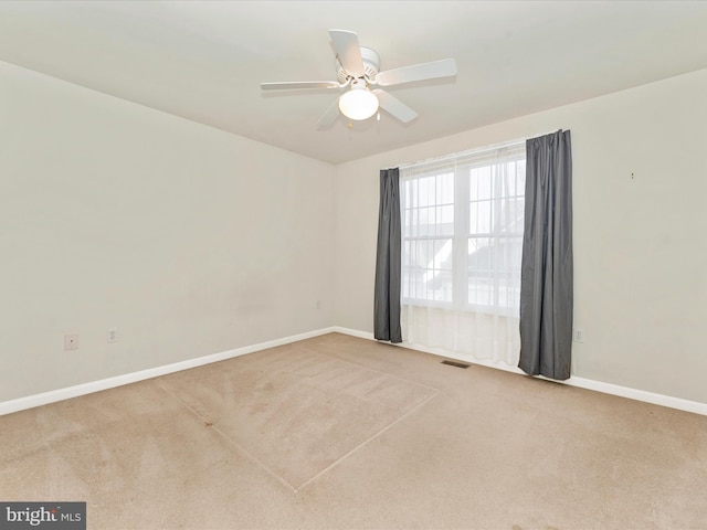 carpeted empty room with ceiling fan