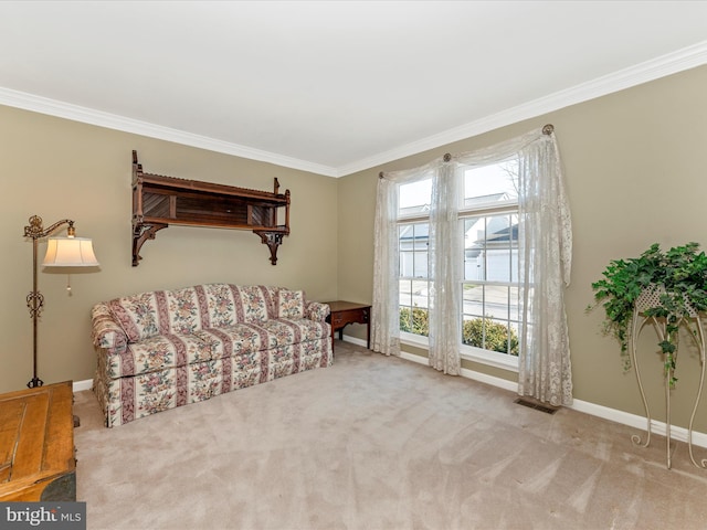 sitting room with light colored carpet and ornamental molding