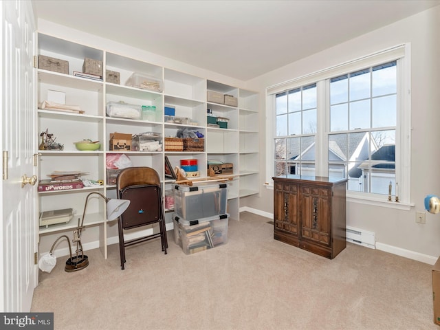 carpeted office featuring a baseboard radiator