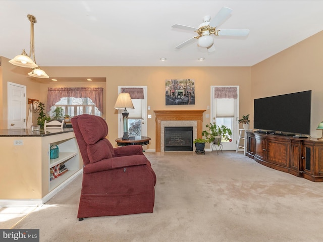 living room with light carpet and ceiling fan